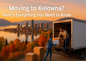 A scenic sunrise view of Kelowna's waterfront with a moving truck and couple loading boxes, symbolizing relocation to the Okanagan Valley