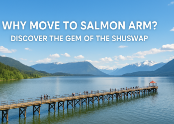 A scenic summer panorama of Salmon Arm, BC with Shuswap Lake, the historic wharf, and surrounding mountains, promoting relocation.
