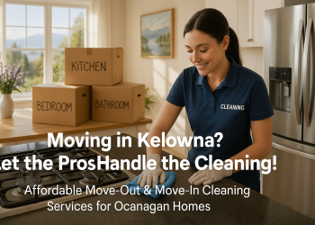 Professional cleaner wiping kitchen counter in a sparkling Kelowna home, moving boxes in the background, sunlight streaming through the windows.”