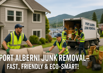 Junk removal team loading household items into a truck in front of a Port Alberni home by the inlet