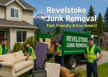 Workers loading household items into a truck outside a mountain-view Revelstoke home.