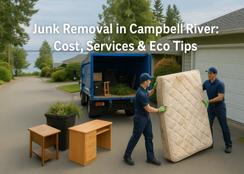 Junk removal workers loading furniture and garden waste onto a truck in a coastal Campbell River neighborhood with ocean in the background.